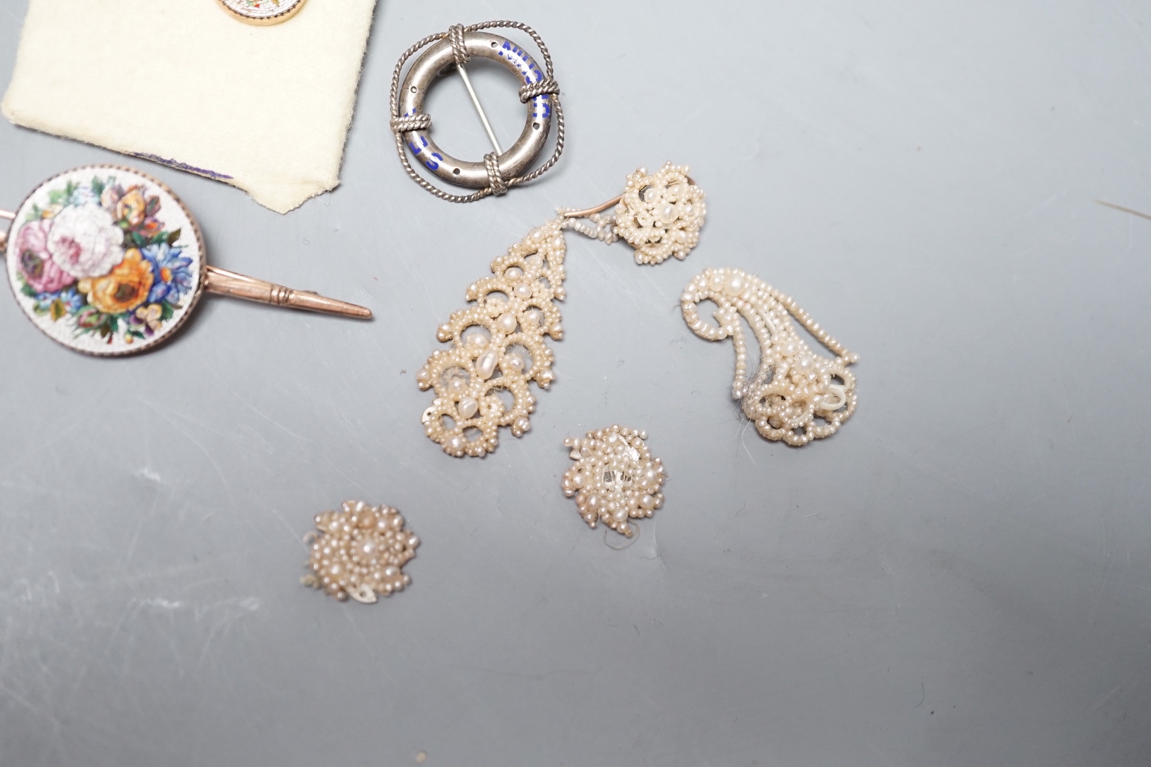 A suite of yellow metal and micro mosaic jewellery comprising a brooch, 72mm and pair of earrings, five items of seed pearl jewellery and a brooch.